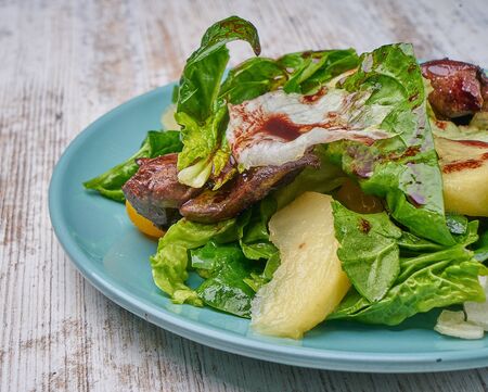 chicken kidney warm salad with greens and avocadoの写真素材