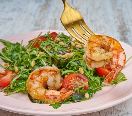 shrimp salad with greens and croutonsの写真素材