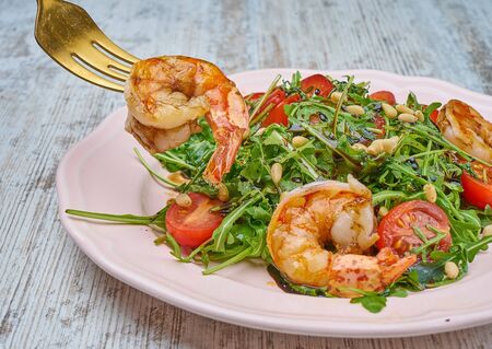 shrimp salad with greens and croutonsの写真素材