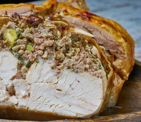 chicken whole stuffed  on wood boardの写真素材