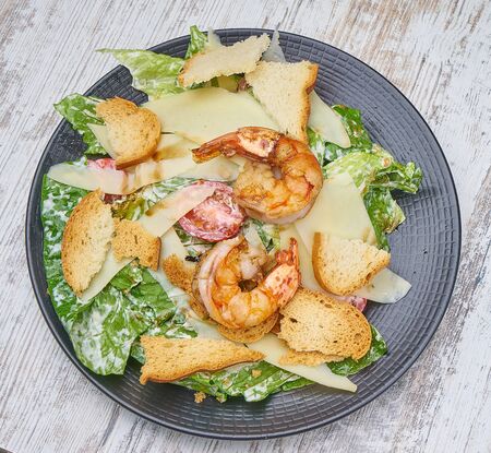 shrimp salad with greens and croutonsの写真素材