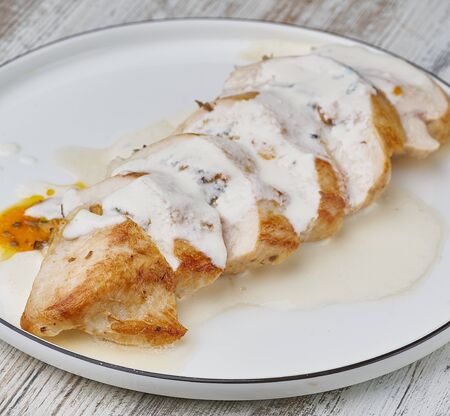 chicken breast sliced stuffed with sauceの写真素材
