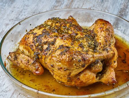 baked chicken homemade with greensの写真素材