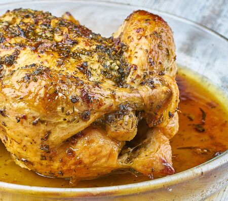 baked chicken homemade with greensの写真素材