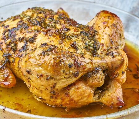 baked chicken homemade with greensの写真素材