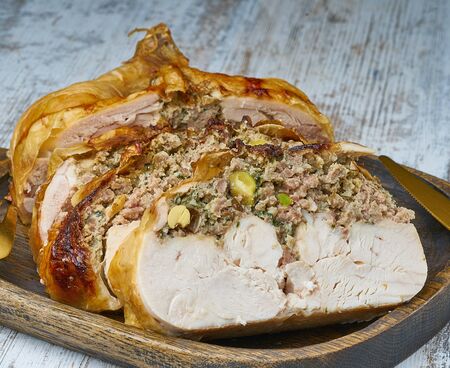 chicken whole stuffed  on wood boardの写真素材