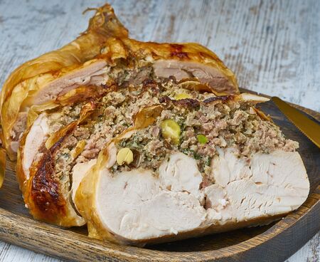 chicken whole stuffed  on wood boardの写真素材