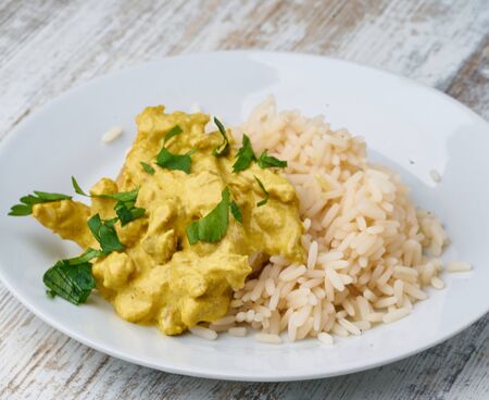 chicken curry with rice homemadeの写真素材