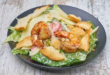 shrimp salad with greens and croutonsの写真素材