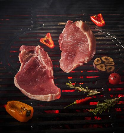 pork chop flying to grill grateの写真素材