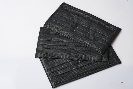 Face mask black anti covid with ribbons on white backgroundの写真素材