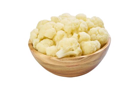 cauliflower in bowl cutted on white frozen vegetablesの写真素材