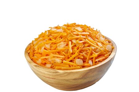 carrot and onions in bowl cutted on white frozen vegetablesの写真素材