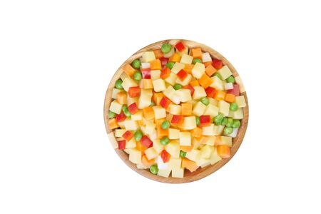 potato, pepper,  peas, carrot in bowl cutted on white frozen vegetablesの写真素材
