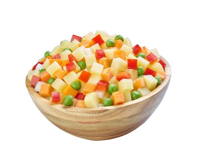 potato, pepper,  peas, carrot in bowl cutted on white frozen vegetablesの写真素材