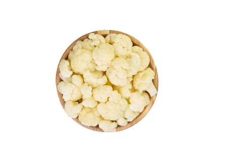 cauliflower in bowl cutted on white frozen vegetablesの写真素材