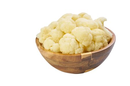 cauliflower in bowl cutted on white frozen vegetablesの写真素材
