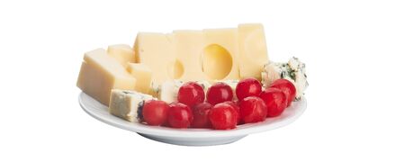 blue cheese and maasdam cheese with cherry tomatoes on whiteの写真素材