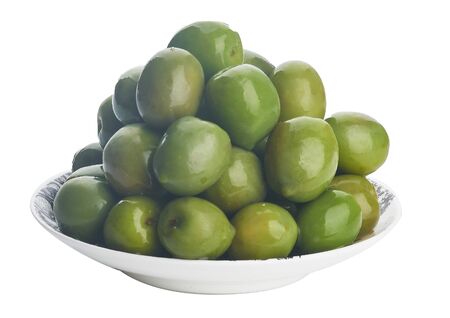 green olives on plate on whiteの写真素材