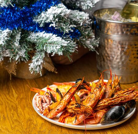 shrimps with new year tree on tableの写真素材