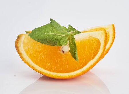two orange slices on white isolatedの写真素材