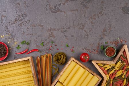 Pasta assorti on gray backgroundwith boxの写真素材