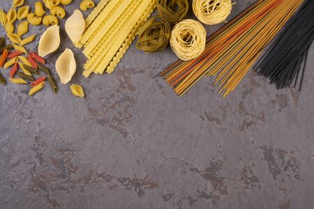 Pasta assorti on gray backgroundwith boxの写真素材