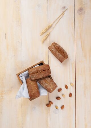 wooden background with bread and fruits verticalの写真素材