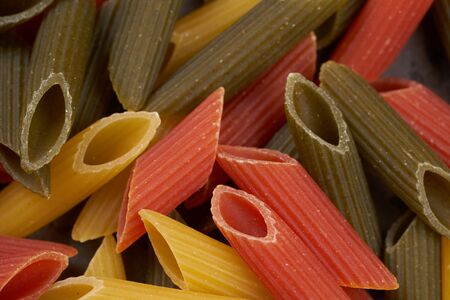 penne texture multicolored italian pastaの写真素材