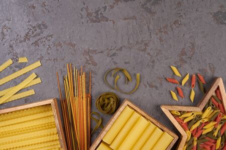 Pasta assorti on gray backgroundwith boxの写真素材