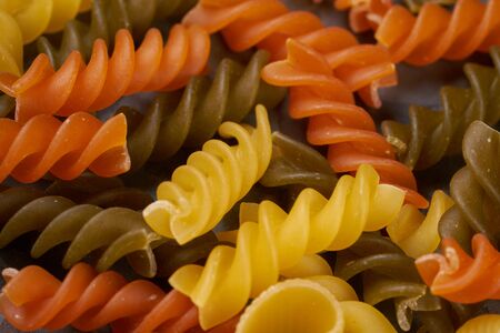 fusili texture multicolored italian pastaの写真素材