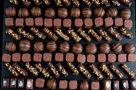 chocolate candies on black stone black background