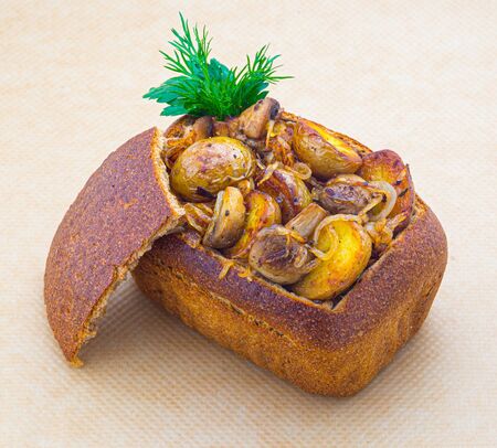 mushroom with potatoes in bread bowl with cupの写真素材