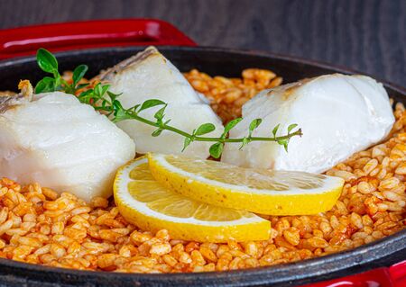 cod with saffron rice with lemonの写真素材