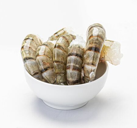 headless shrimp in a white plateの写真素材