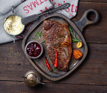 steak on a wooden tray on woodの写真素材