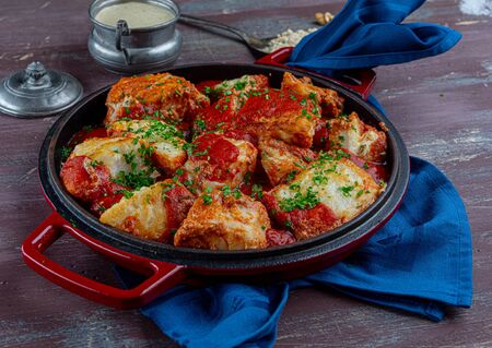 fried cod in a pan on blue napkinの写真素材