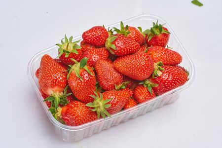 fresh strawberries in eco bio packaging  on whiteの写真素材