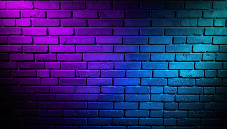 A brick wall is lit with violet light on the left side and blue light on the right, creating a dark, modern, and vibrant abstract illuminated wall.の素材