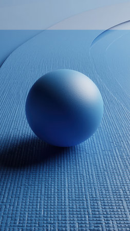 A single blue sphere with a granular texture rests centered on a subtly patterned blue surface. The background features smooth, undulating blue forms, creating a serene, monochromatic abstract composition.の素材