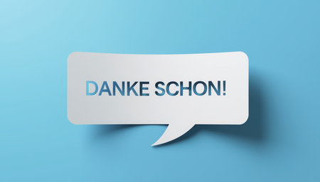 A crisp white paper speech bubble with the German phrase DANKE SCHON! (Thank You) centrally placed, casting a subtle shadow on a clean, light blue background. The cutout style gives it a distinct three-dimensional appearance.の素材