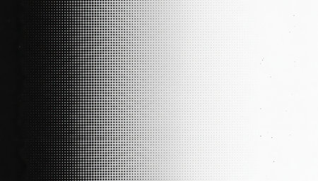 This abstract monochrome composition showcases a subtle yet striking gradient progression. On the left, a dense arrangement of dark, interconnected circular or irregular shapes forms a distinct textured pattern, reminiscent of cellular structures or a digital matrix. As the view moves horizontally towards the right, these elements gradually diminish in opacity and density, transitioning smoothly into a pristine white expanse. The visual effect conveys a sense of data processing, scientific analysis, or minimalist aesthetic. This sophisticated backdrop is well-suited for various applications, including technological presentations, corporate branding, or contemporary design layouts that require depth and subtle visual interest.の素材