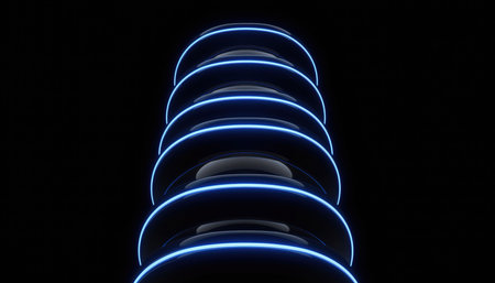 The visual presents a series of glowing blue light rings, stacked vertically, creating an abstract and futuristic pattern. The dark background enhances the luminous effect, giving a sense of depth and technology. It resembles a digital tunnel or a conceptual structure.の素材