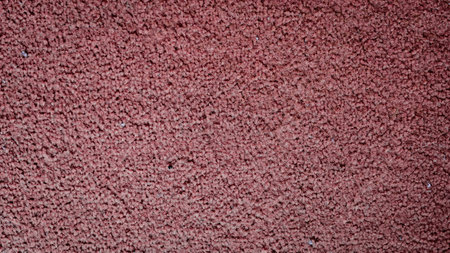 A rich, warm fabric unfolds across the surface, showcasing a beautiful depth of red tones that evoke feelings of comfort and coziness. Its soft texture invites gentle caresses.の写真素材