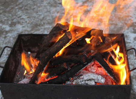 Lighting firewood in the barbecue grill