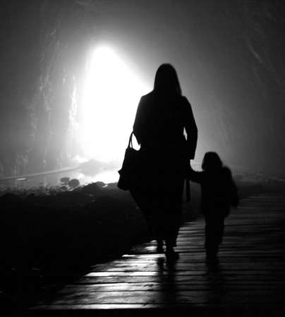 walking to the light,  Woman and child are walking to the light の写真素材