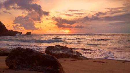 Dramatic sunset panorama at Suluban Beach, Bali, Indonesiaの写真素材