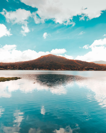 Beautiful landscape of mountain lake with blue sky and cloud background.の写真素材