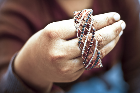 Human hand holding bangles.の写真素材