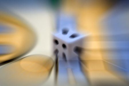 die on a board with motion blur zoom effect.の写真素材